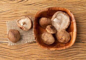 Shimeji mushrooms in a bowl over wooden table