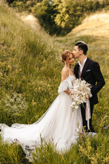 Stylish newlywed couple in love together in nature