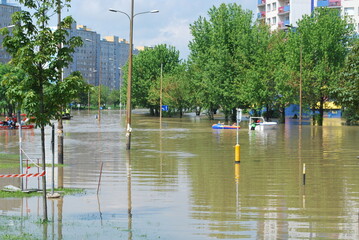 Wrocław, Kozanów housing estate, flood of May 2010. You can see residential buildings, water on the street, flooded city. - obrazy, fototapety, plakaty