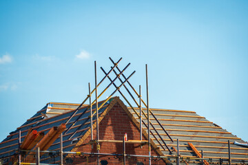 new built houses over clear blue sky in england uk