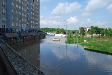 Wrocław, Kozanów housing estate, flood of May 2010. You can see residential buildings and a car...