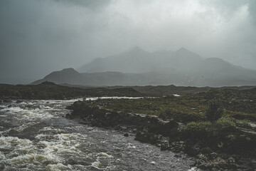 Marshland at the foot of misty mountain