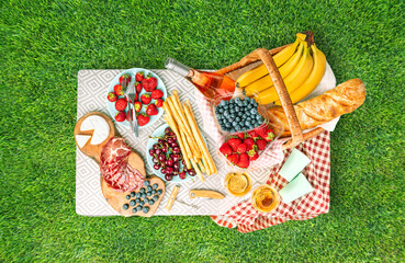Serving a picnic on the table in nature on the lawn. Top view.