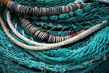 Close-up on pile of fishing lines and nets.