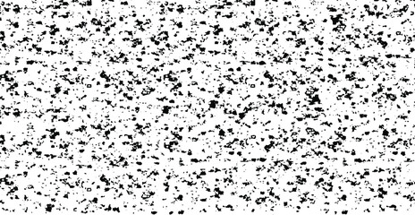 Small uneven spots and particles of debris. Abstract vector texture. Distressed uneven background. Grunge texture overlay with fine grains isolated on white background. Vector illustration. EPS10.