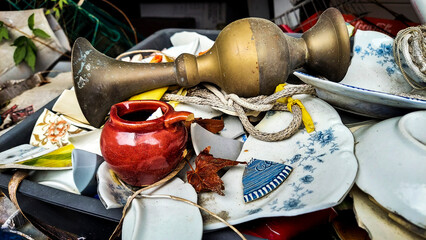 Broken Pottery with a Broze Pot and Broken Dishes