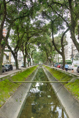 Fototapeta na wymiar Santos city canal, flowing through town into the sea. Brazil