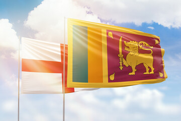 Sunny blue sky and flags of sri lanka and england