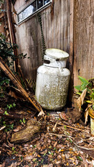 Propane Steel Tank Abandonded In a Messy Yard