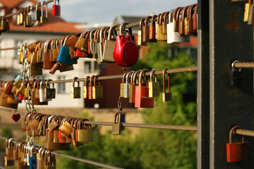 Bamberg, northern Bavaria, Upper Franconia, Germany, 11 of June 2022. Lovelocks hanging on the railings of the Chain suspension Brige (Kettenbrücke) over the Main-Danube Canal. 