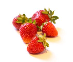 red strawberries on a white background