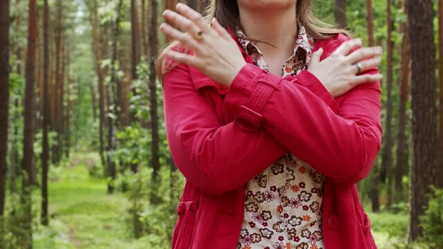 Female tapping her shoulders, crossing hands. Butterfly hug. Psychology and self-care concept.
