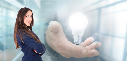 business woman with hand with light bulb, sustainable energy saving