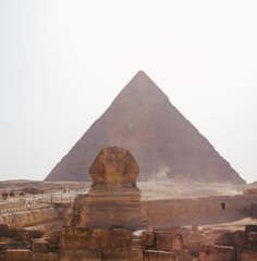 a tourist man looks at the Egyptian pyramids