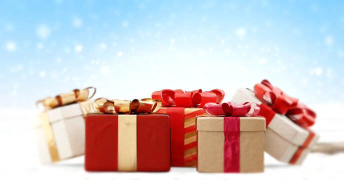 Christmas gifts on snow. partly blurred background 3d-illustration