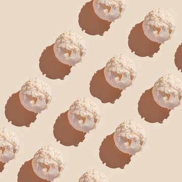 Ice cream balls pattern with copy space on a pastel beige background. Summertime, dessert minimal concept. Top view. Bubble gum gelato, hard light