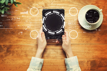 Tech circle with a person holding a tablet computer