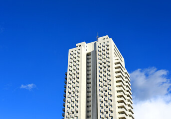 Fototapeta premium Facade of a building. Residential building with balconies and windows. Colorful buildings apartments. House with window and balcony. Buildings architecture in Europe..