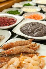 .Shrimp-based dish with various herbs and spices.
