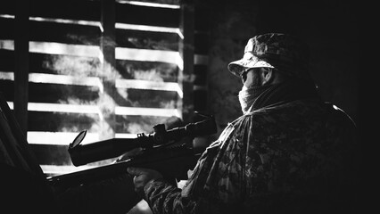 Ukrainian sniper in defense of his country. black and white photo.