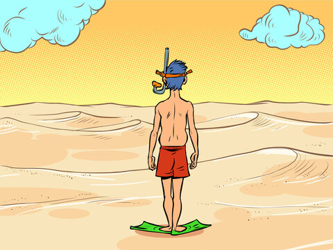 a man in a scuba diving mask stands in front of the desert sands, there is no water. Global warming ecology concept