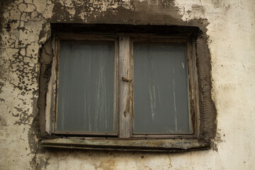 Obraz na płótnie Canvas Old window in wall. Ruined wall with wooden window.