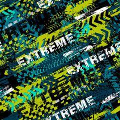 Abstract seamless grunge pattern for boy. Urban style modern background with trace of tire, text and spray elements. Extreme modern creative wallpaper for guys.