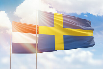 Sunny blue sky and flags of sweden and netherlands - obrazy, fototapety, plakaty