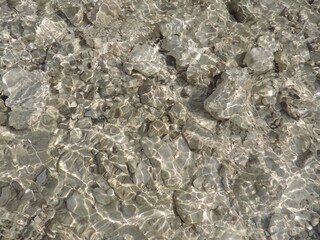 Fototapeta premium Texture of the stone and water reflection