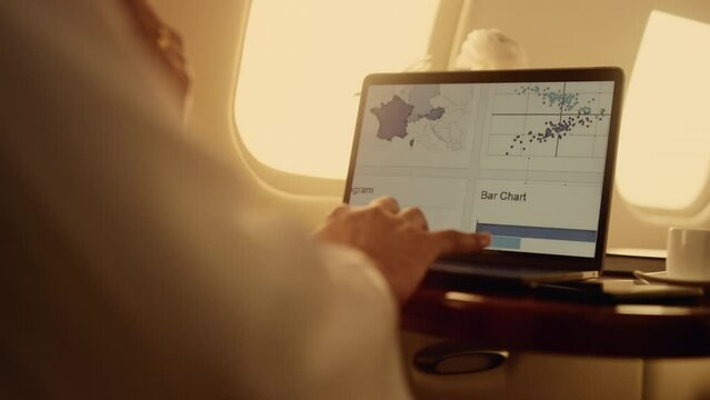 Manager hands working graphs on laptop computer closeup. Man using touchpad