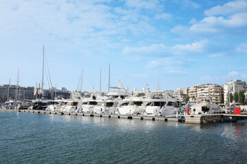 Fototapeta na wymiar Picturesque view of port with modern boats on sunny day
