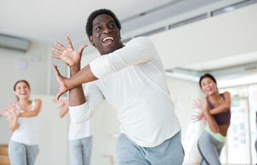 Group of multinational activity people practicing dance techniques