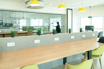 Co working space with working desks and chairs. Open office space.