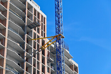 Crane and highrise construction site