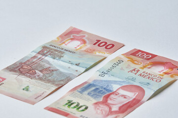 Mexican money, Mexican pesos bills and coins on white background