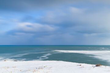 Fototapeta na wymiar Long exposure view of the sea of Okhotsk from Cape Hinode in winter, Hokkaido, Japan