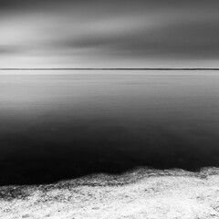 Moody long exposure view of lake Saroma in winter, Hokkaido, Japan