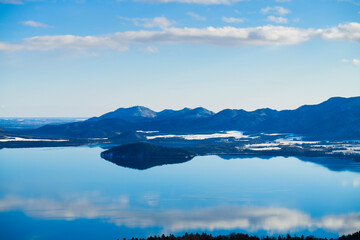 View of lake Kussharo in Winter from Bihoro Pass Observatory, Hokkaido, Japan