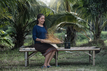 person sitting on a bench in the farm. Portrait woman in thai vintage traditional in farm.