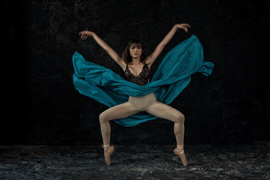 young ballerina with a perfect body is dancing in a photo studio, dancers are dressed in fashionable outfits, this picture is taken in minimal style, showing the beauty of classical art like ballet.