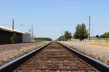 Fototapeta na wymiar Rail Road Tracks with Blue Sky