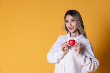 Young women hands holding red heart, heart health insurance, organ donation, happy volunteer charity, CSR social responsibility,world heart day, world health day,world mental health day,foster home co