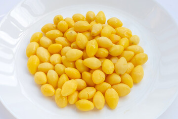 Boiled ginkgo nuts on white background.