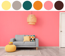 Comfortable sofa and pouf near pink wall. Different color patterns