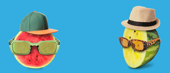 Fototapeta premium Funny yellow watermelon wearing sunglasses and hat on blue background