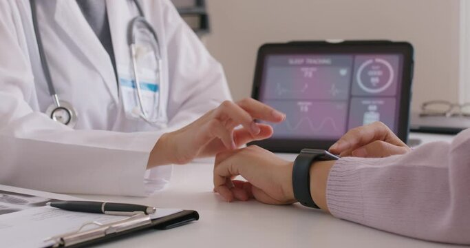 Close-up GP advice AI smart IoT watch guide to patient help collect ECG data, pulse heart rate, blood pressure, wrist sensor sport solution record connect to clinic health device digital platform app.