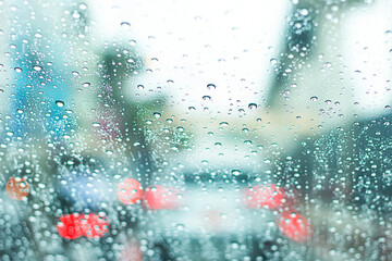 Blurred image of a car on the road on a rainy day.