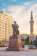 Fototapeta na wymiar CAIRO, EGYPT - DECEMBER 29, 2021: Omar Makram Statue near Omar Makram Mosque on Tahrir square in Cairo, Egypt