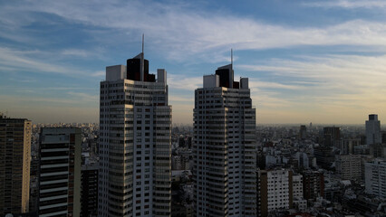 Fototapeta na wymiar Twin skyscrapers and blue sky in Buenos Aires city at sunset, South America