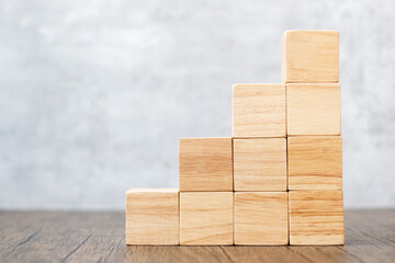 Cube wooden block on the building. Business goal, growth, planning, Risk Management, Solution,...